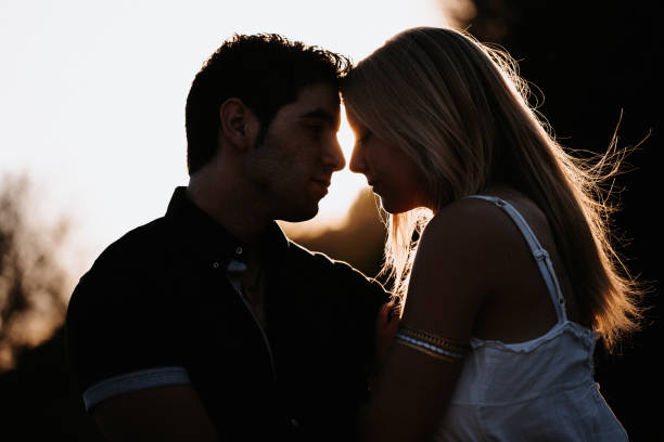istock Low key silhouette image of a young couple 1275851632