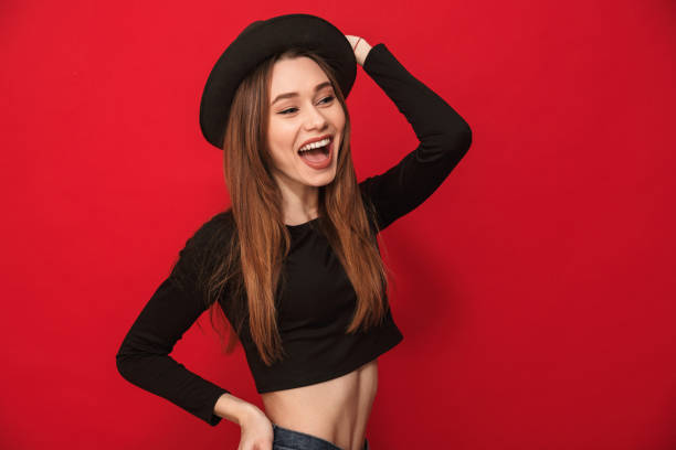 istock Happy young woman standing isolated 1275851690