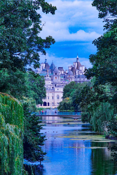 istock Buildings among park growth reflected in water 1275852319