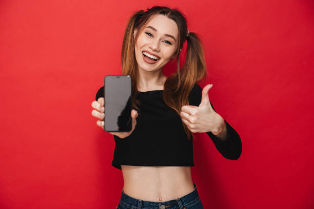 istock Excited lady showing display of mobile phone 1275852346
