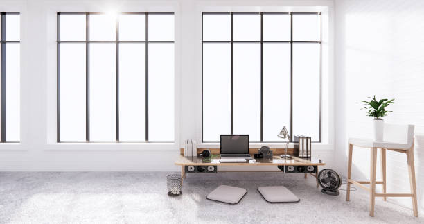 istock The interior Computer and office tools on mini desk in white concrete floor and white brick wall design. 3D rendering 1275852587