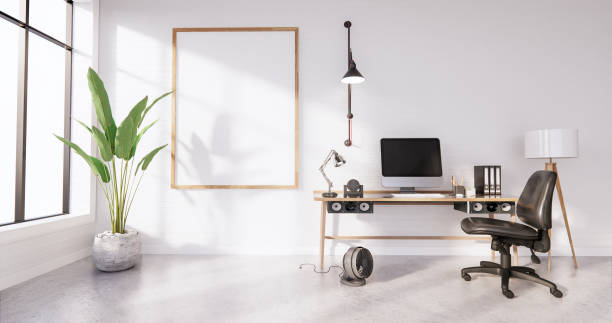 istock The interior Computer and office tools on mini desk in white concrete floor and white brick wall design. 3D rendering 1275852616