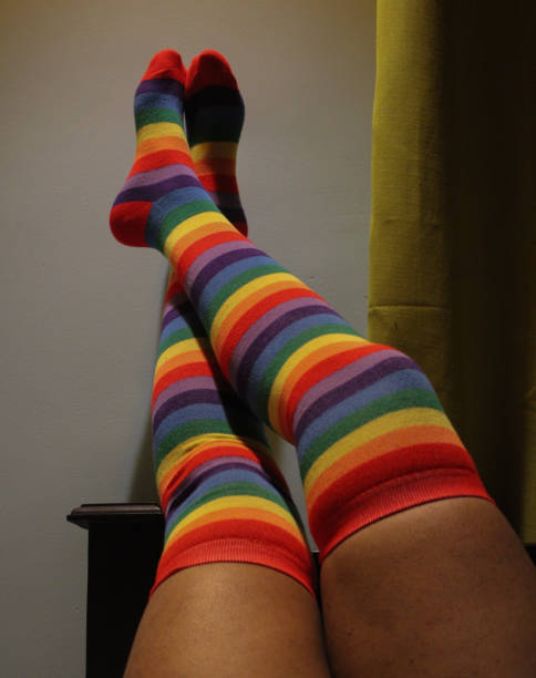 Sexy legs of a teenage girl wearing rainbow knee high socks Sexy legs of a teenage girl wearing rainbow knee high socks asian women in stockings stock pictures, royalty-free photos & images