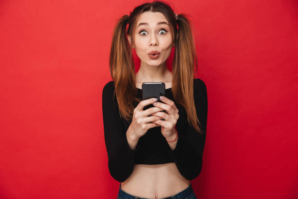 istock Excited lady standing isolated chatting 1275853146