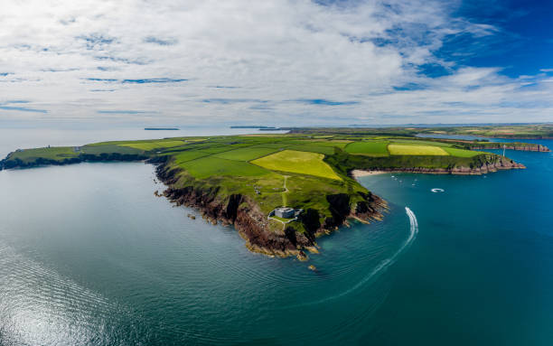 Aerial view of an old coastal fort, ocean and fields Aerial view of 19th century coastal fort on clifftops surrounded by fields and ocean (Milford Haven, Wales) milford haven stock pictures, royalty-free photos & images