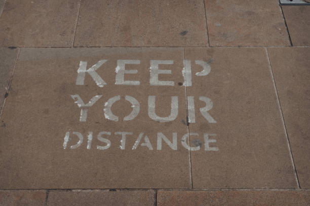 istock Keep your distance sign on a pavement in Oxford, UK. 1275853777