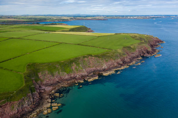 istock Aerial view of fields and ocean 1275853798
