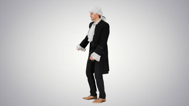 Young gay actor dressed in period costume inside design studio. Interior of creative studio at home in Hamilton, Canada.