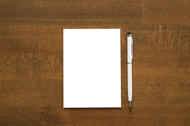 istock Blank paper and a pen 1275854391