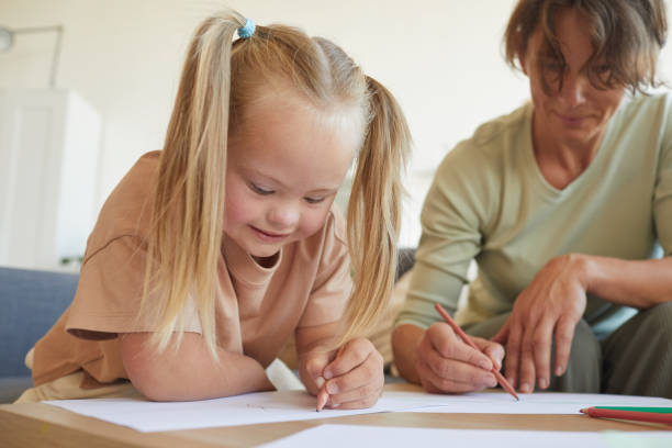 istock Smiling Girl with Down Syndrome Drawing 1275856644