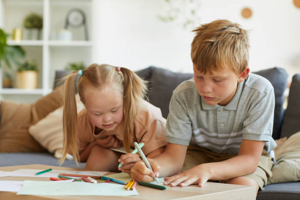 istock Brother and Sister Drawing Together 1275856674