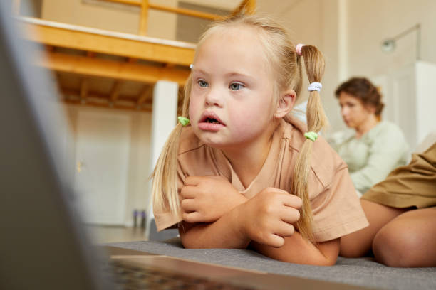 Girl with Down Syndrome Watching Videos