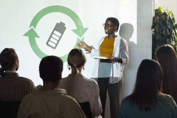 Young African Woman Presenting at Ecology Conference