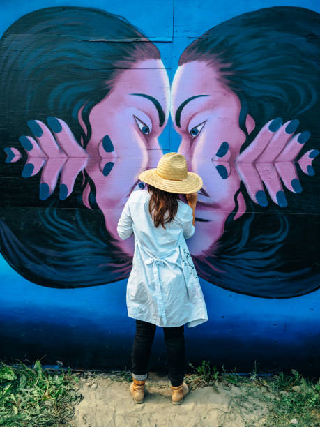 istock Female mural artist at work 1275860296