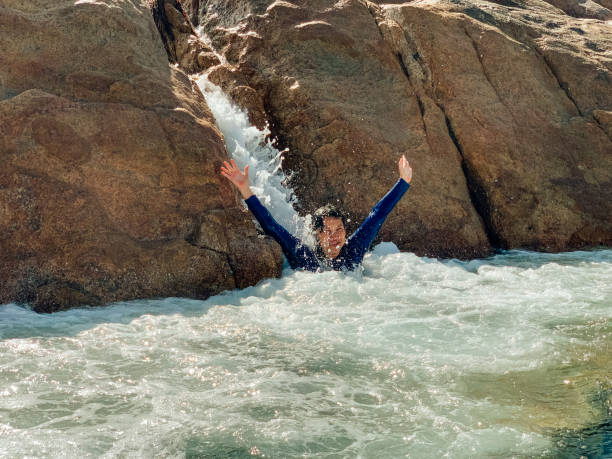 istock Having Fun On The Natural Slide 1275860303