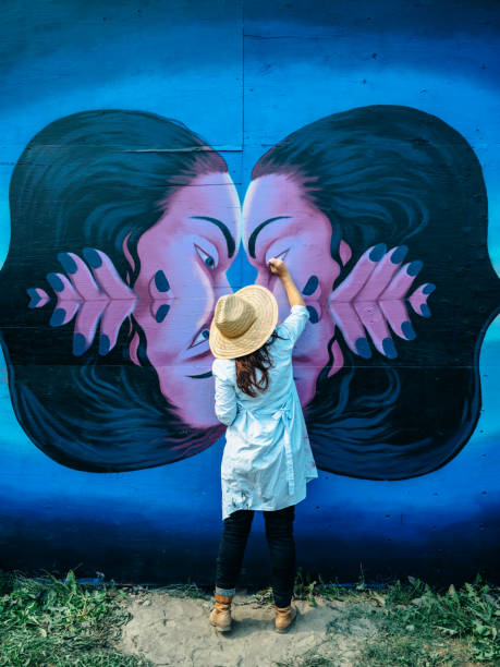 istock Female mural artist at work 1275860579