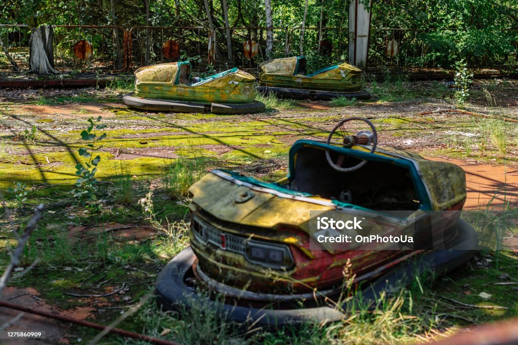 Abandoned Amusement Car Ride in park of attractions in Ghost City of Pripyat in Chernobyl Exclusion Zone Abandoned Amusement Car Ride in park of attractions in Ghost City of Pripyat in Chernobyl Exclusion Zone, nuclear catastrophe Pripyat City Stock Photo