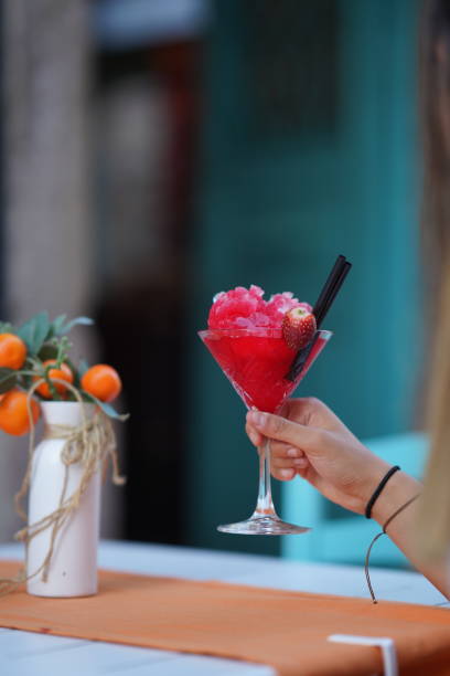 istock Beautiful Woman Drinking Fresh Cocktail with Strawberry 1275863082