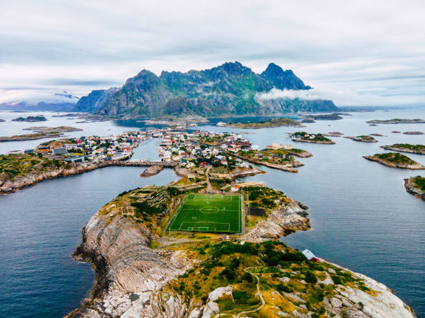 Aerial view of Henningsvaer archipelago and football stadium on Lofoten islands This image shows Aerial view of Henningsvaer archipelago and famous football stadium on Lofoten islands lofoten stock pictures, royalty-free photos & images