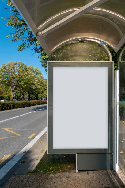 istock Blank advertisement mock up in a bus stop 1275866247