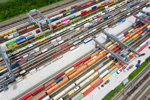 Large group of cargo containers and freight trains, aerial view, Germany, Europe.