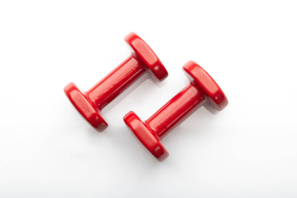 istock Top View of Red Colored Dumbbells on White Background 1275867261