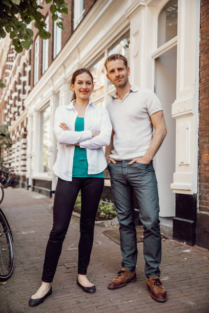 istock Young couple in their home 1275867452