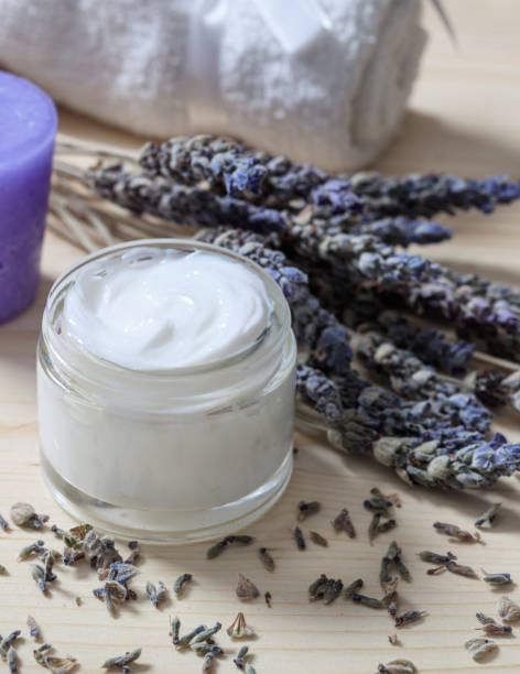 istock Moisturizing cream and lavender on wooden background 1275868491