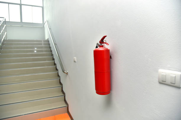 istock A fire extinguisher hung on the wall, lined with fire escapes. 1275871357