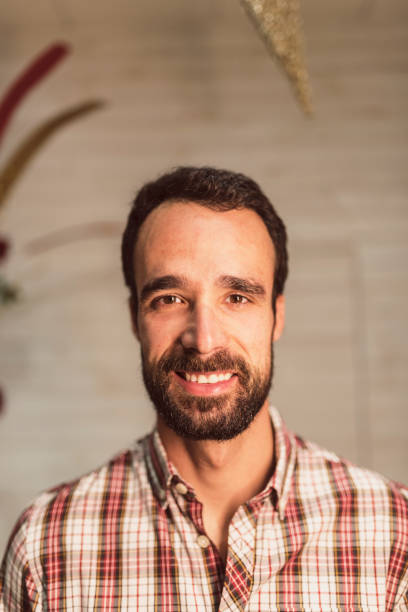 istock Plaid shirt smiling man portrait 1275871505
