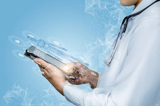 istock Doctor works with patient information on a tablet . 1275871681