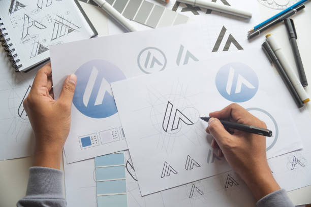 istock Graphic designer creative design sketch drawing logo Trademark brand Workspace 1275873487