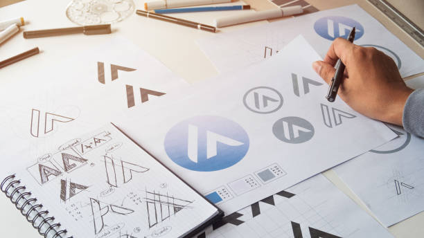 istock Graphic designer creative design sketch drawing logo Trademark brand Workspace 1275873489