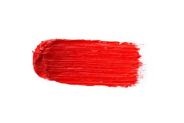 istock Lipstick smear smudge swatch isolated on white background. Cream makeup texture. Bright red color cosmetic product brush stroke swipe sample 1275878407