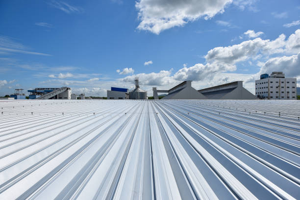 istock Roofing and lightning faraday systemon installed on new warehouse with exsiting old building warehouse and blue sky background 1275879016
