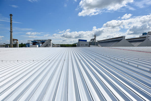 istock Roofing and lightning faraday systemon installed on new warehouse with exsiting old building warehouse and blue sky background 1275879018