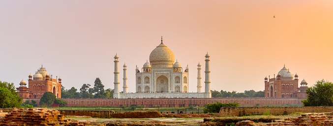 Panoramic View of The Taj Mahal complex across the Yamuna River at the time of sunset - Agra, India.