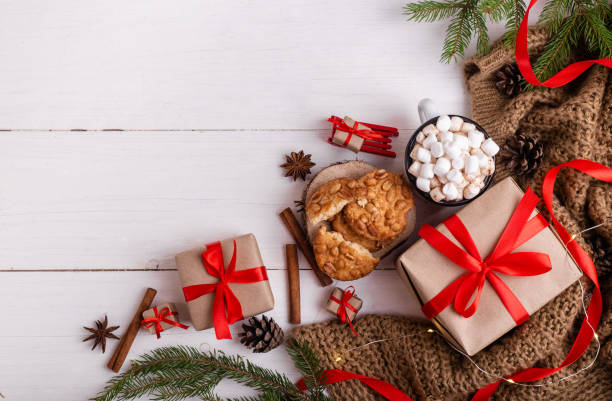 istock Christmas greeting card. Burning candles, fir branches, cocoa with marshmallows. 1275882736