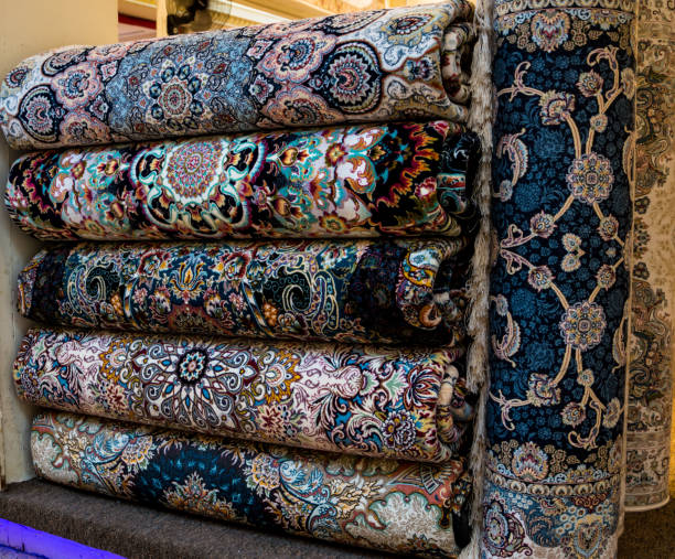 istock Rolled-up rugs on the counter in the Eastern market. 1275883574