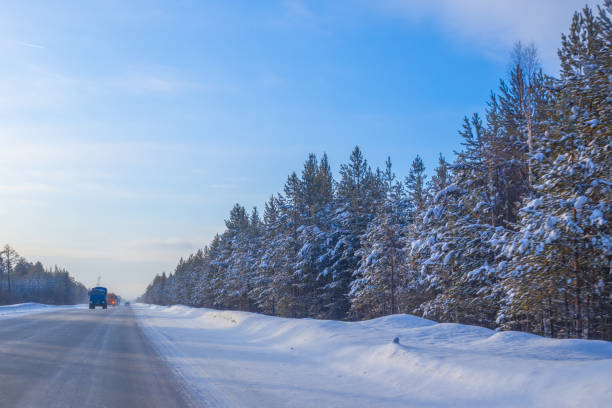 istock winter road on a sunny day 1275885087