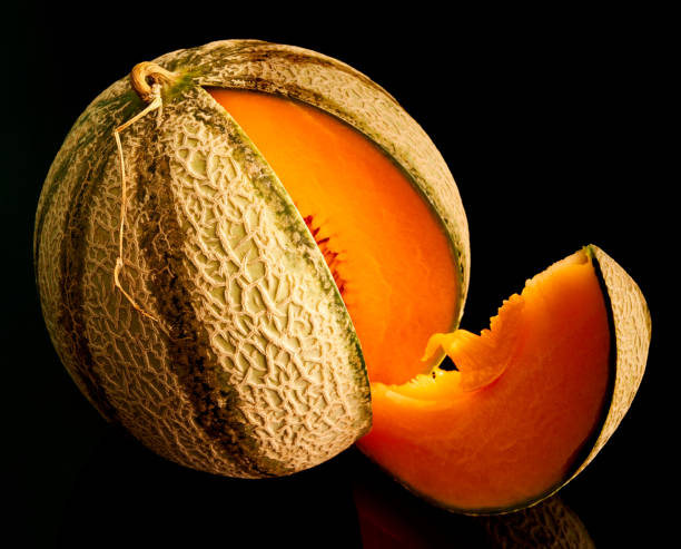 istock melon lies on a black background 1275885887