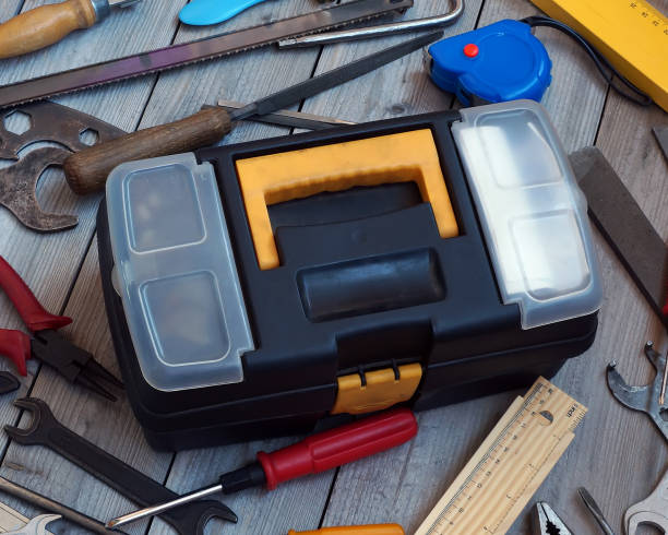 istock Tool box on wooden floor, view from above. 1275894090