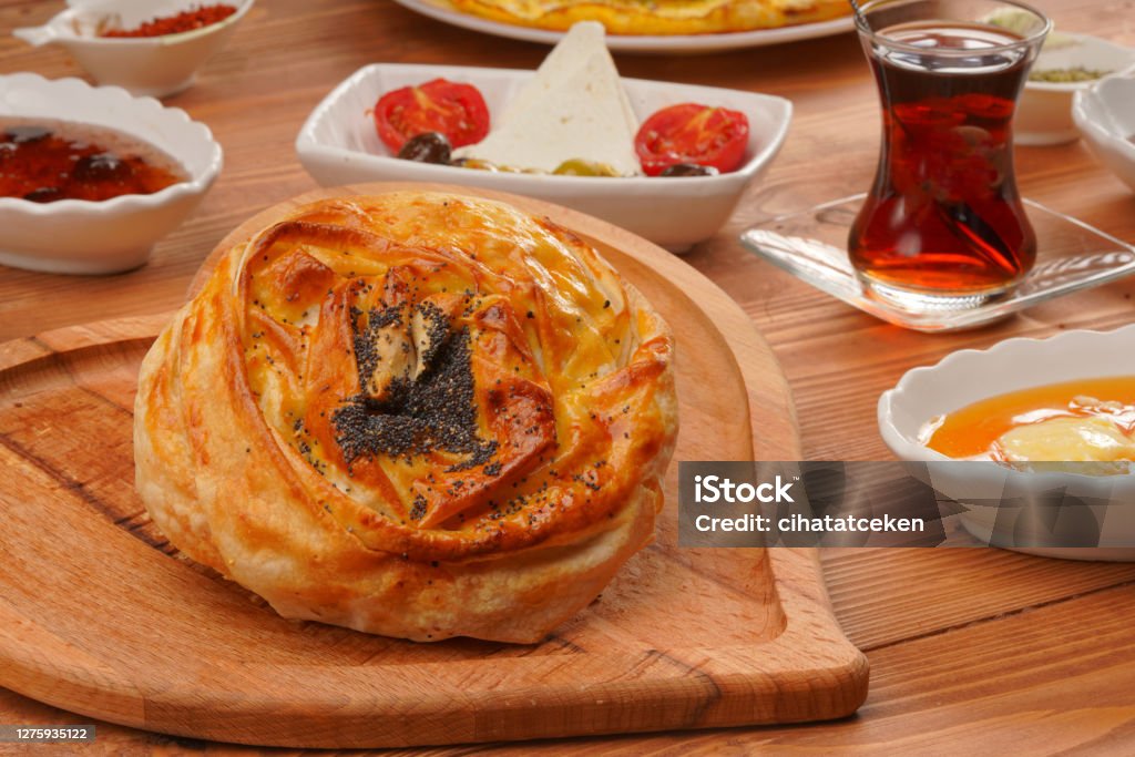 Turkish Pastry Pogaca with Tea / Tea on wooden surface. Traditional oven Haz Turkish breakfast Appetizer Stock Photo