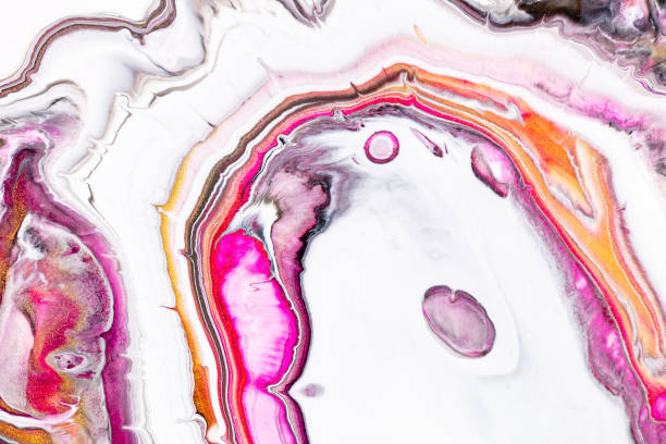 istock Fluid art texture. Background with abstract mixing paint effect. Liquid acrylic artwork with flows and splashes. Mixed paints for website background. Pink, golden and white overflowing colors. 1275942430