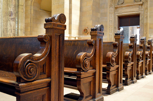 Wooden church pews in a cathedral in St. Paul, Minnesota