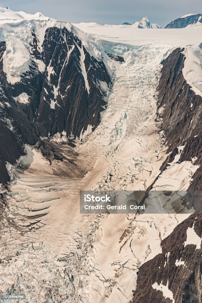 Bergschrunds, Crevasse, Icefalls on Alaskan Glacier, Scenic Flight over Glacier Bay National Park, Alaska. Glacier features from the air. Arete and cirques. Alaska - US State Stock Photo