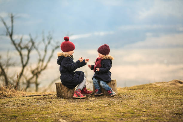 istock girls in mountains playing - rock, scissors, paper 1275996784