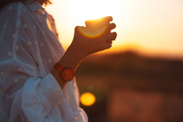 istock Young Woman Enjoying on Holiday at Sunset 1276014415