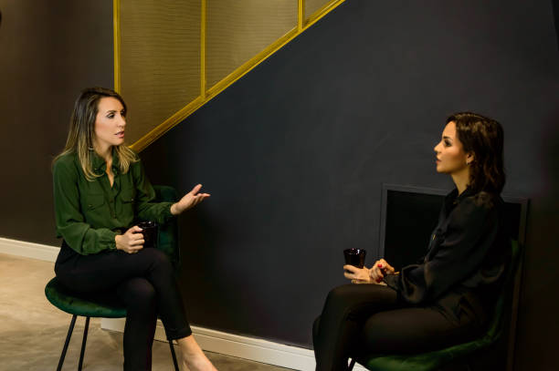 istock Two women talking, keeping distance 1276016557