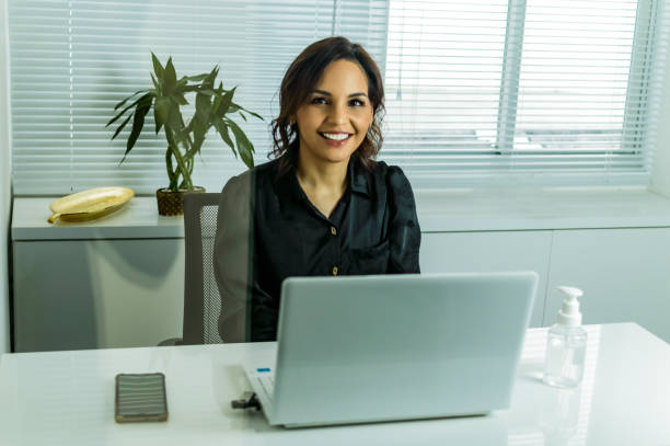istock a woman in the office, doing online service 1276020460
